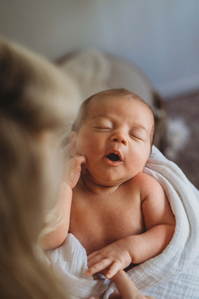 newborn baby yawning during her newborn photos