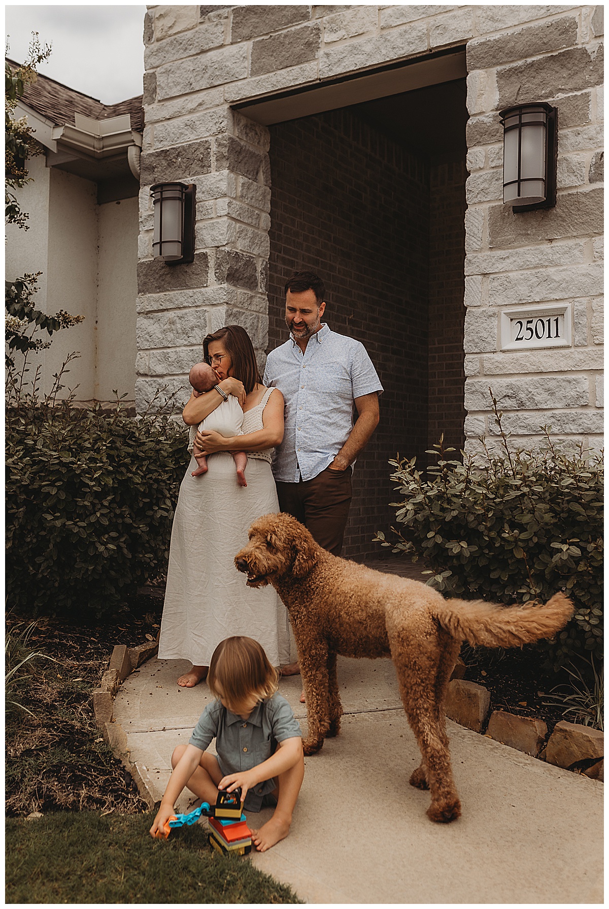 Parents and kids stand outside together for The Woodlands Family Photographer