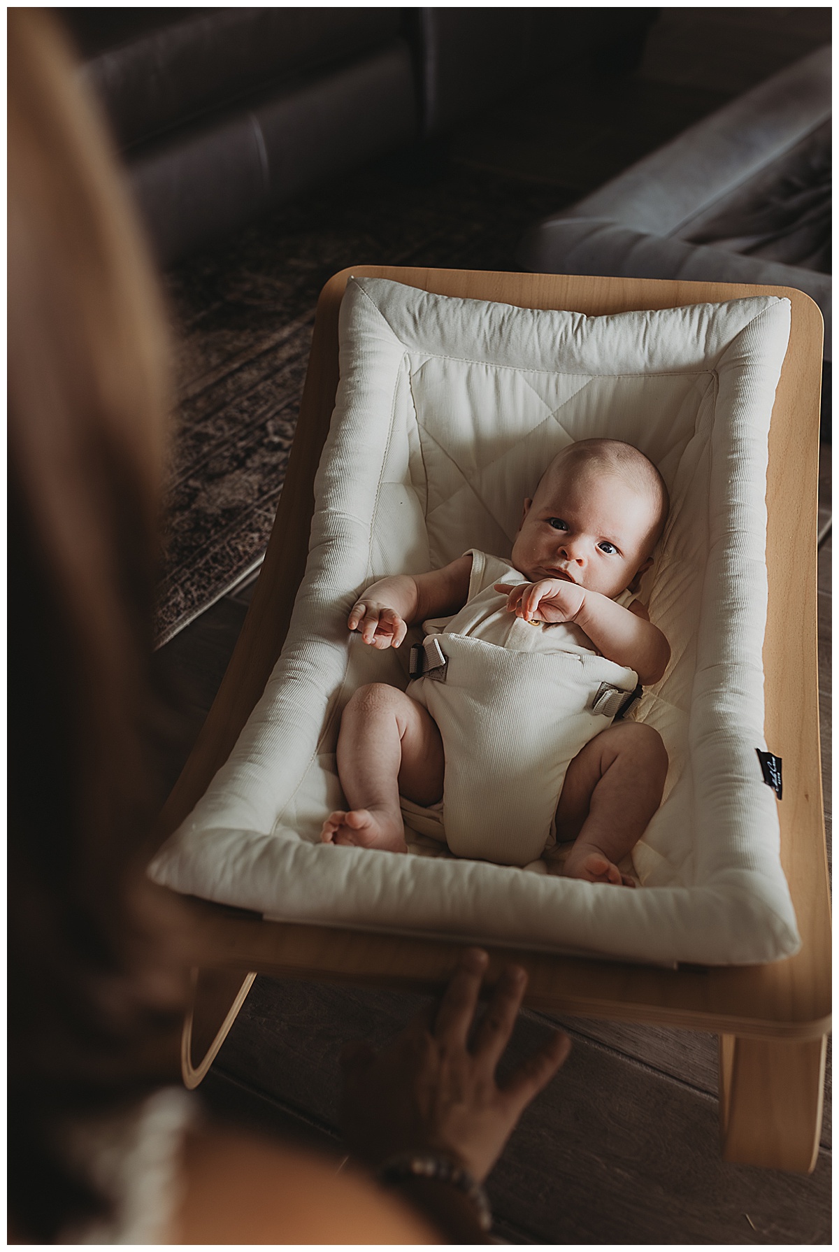 Baby lays in small rocker by Maria Grace Photos