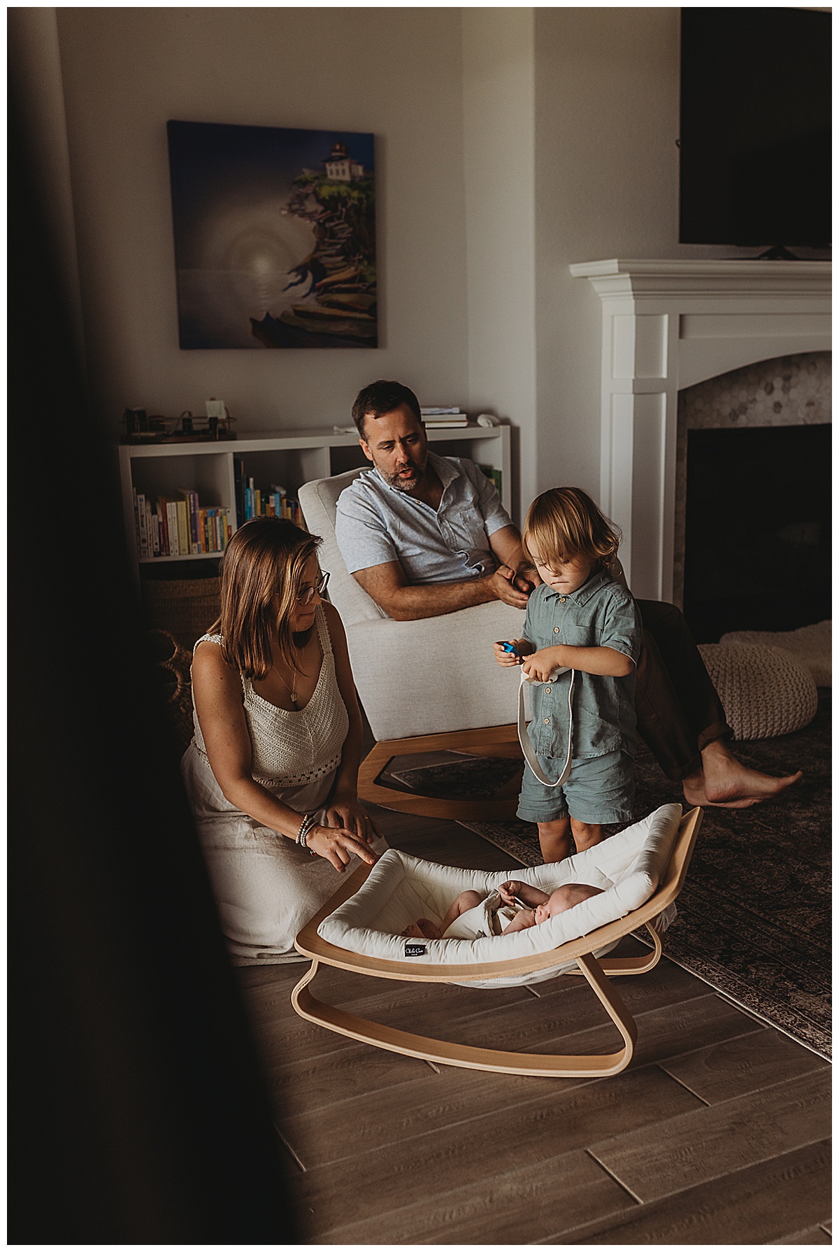 Family sit together showing Why You Should Choose An In-Home Newborn Session 