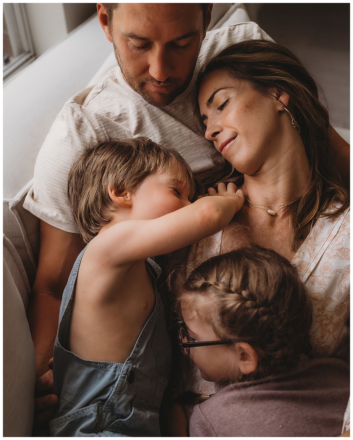 Family all cuddle together for The Woodlands Family Photographer