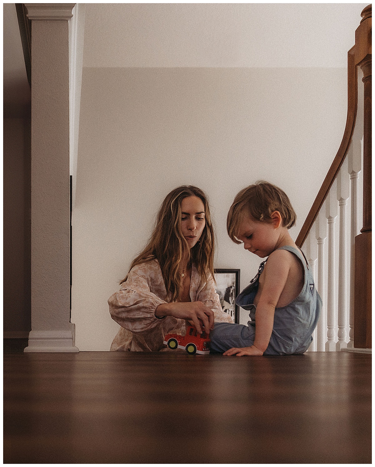 Mom and son play with trains together doing one of the Fun Activities To Do During An In-Home Session 