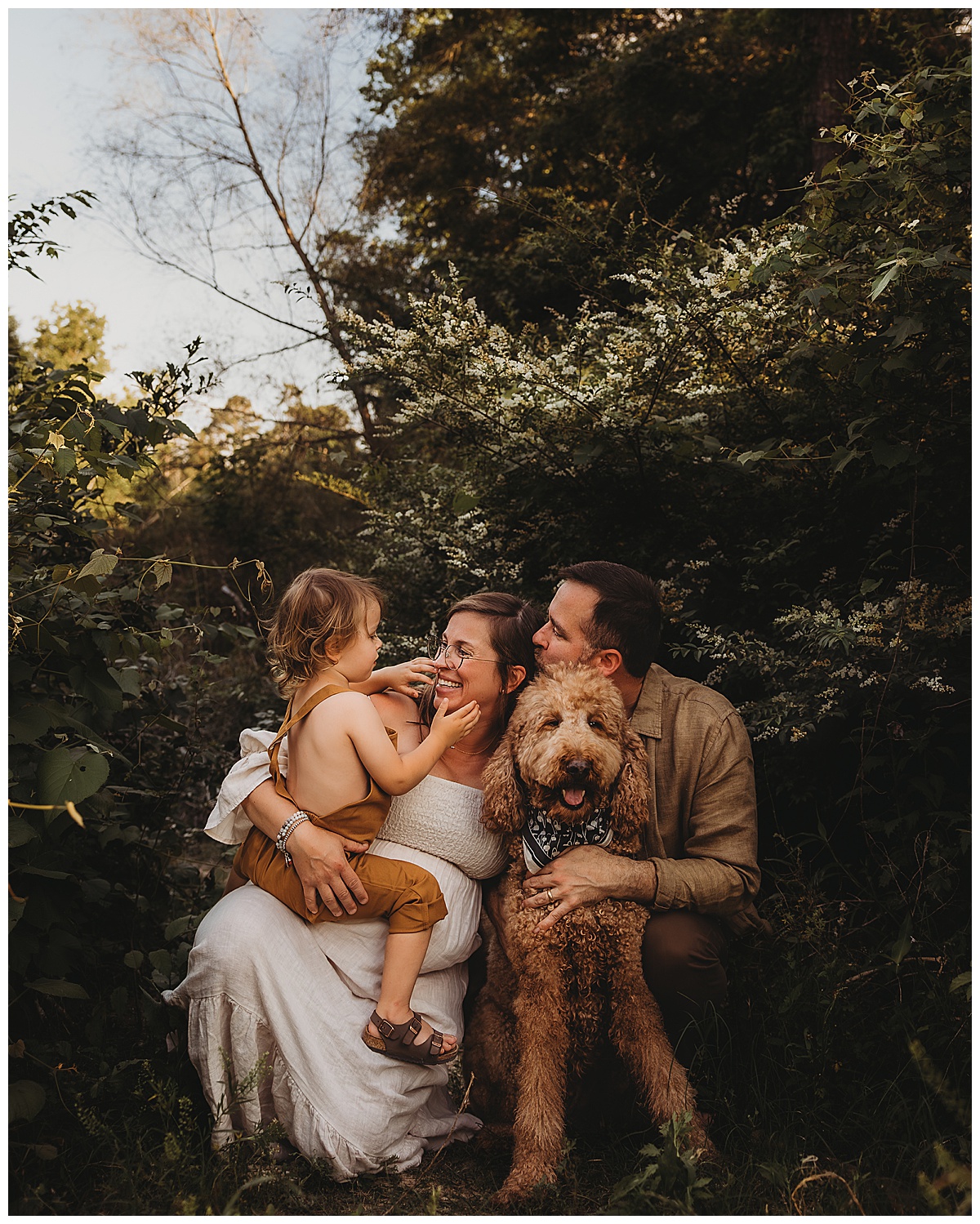 Parents smile at their young child during their Lifestyle Photography session 