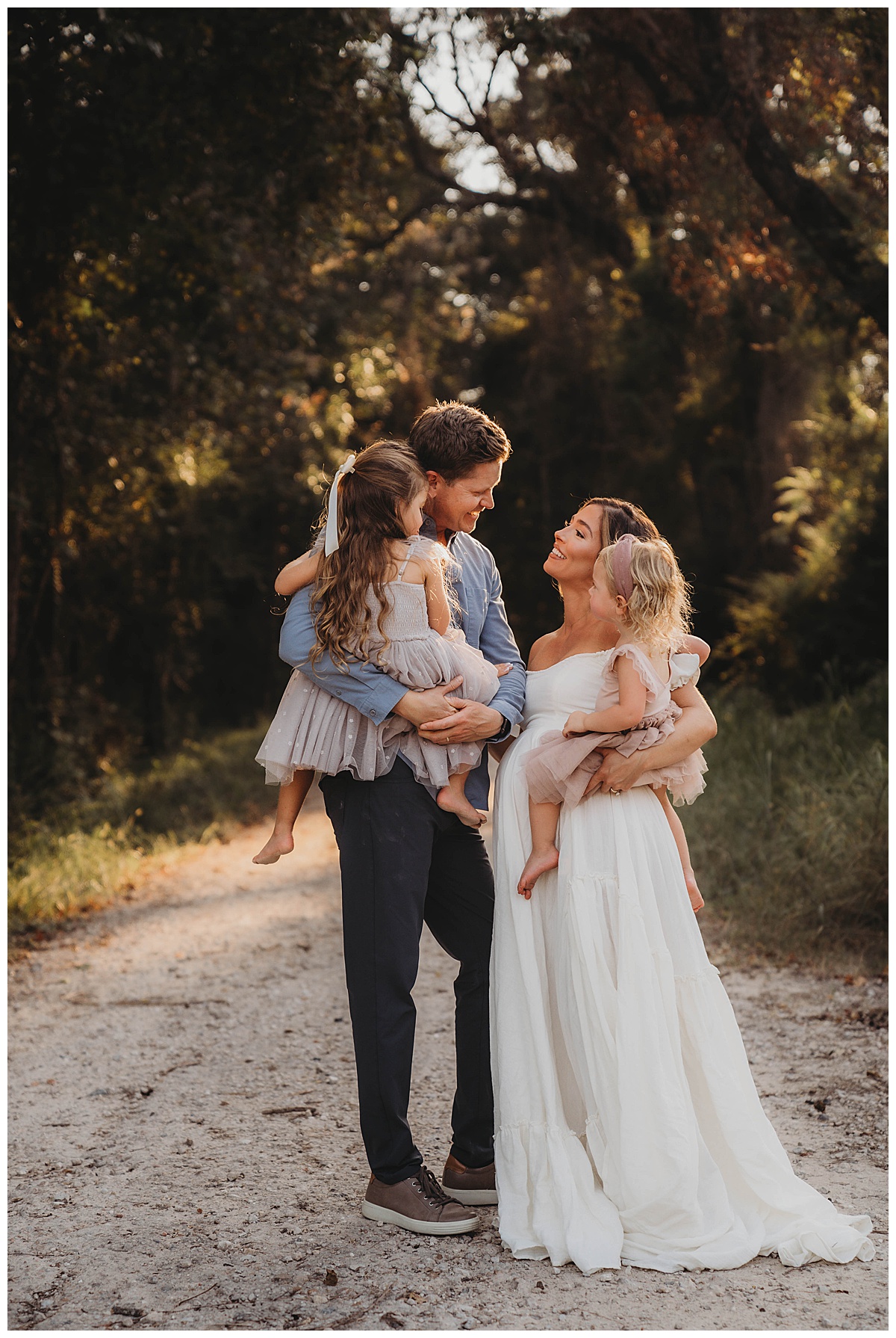 Family stand together and smile for The Woodlands Family Photographer