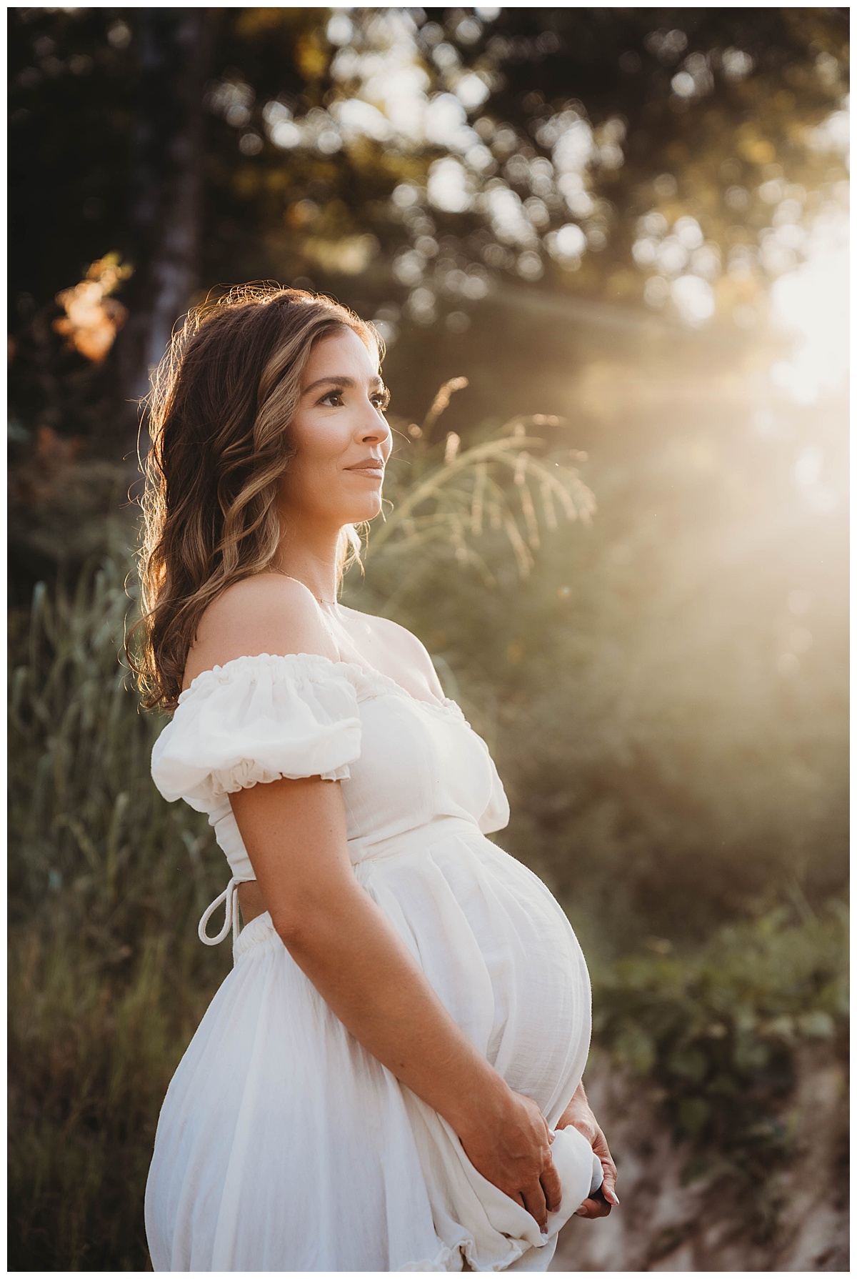 Mom embraces pregnant belly by The Woodlands Family Photographer