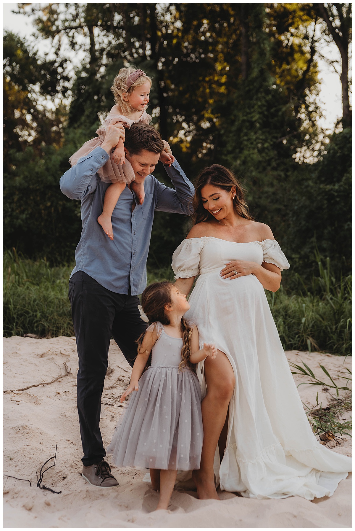 Mom embraces pregnant belly showing the Perfect Time for Maternity Photos