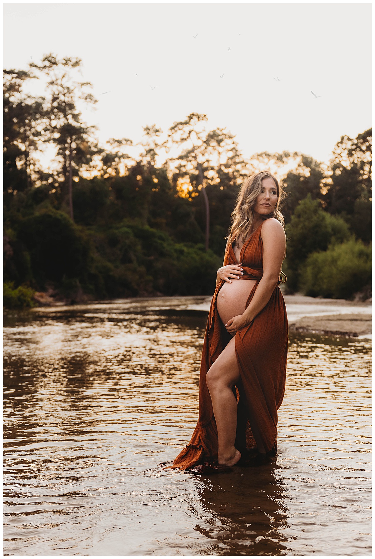 Woman embraces her baby bump showing the Perfect Time for Maternity Photos