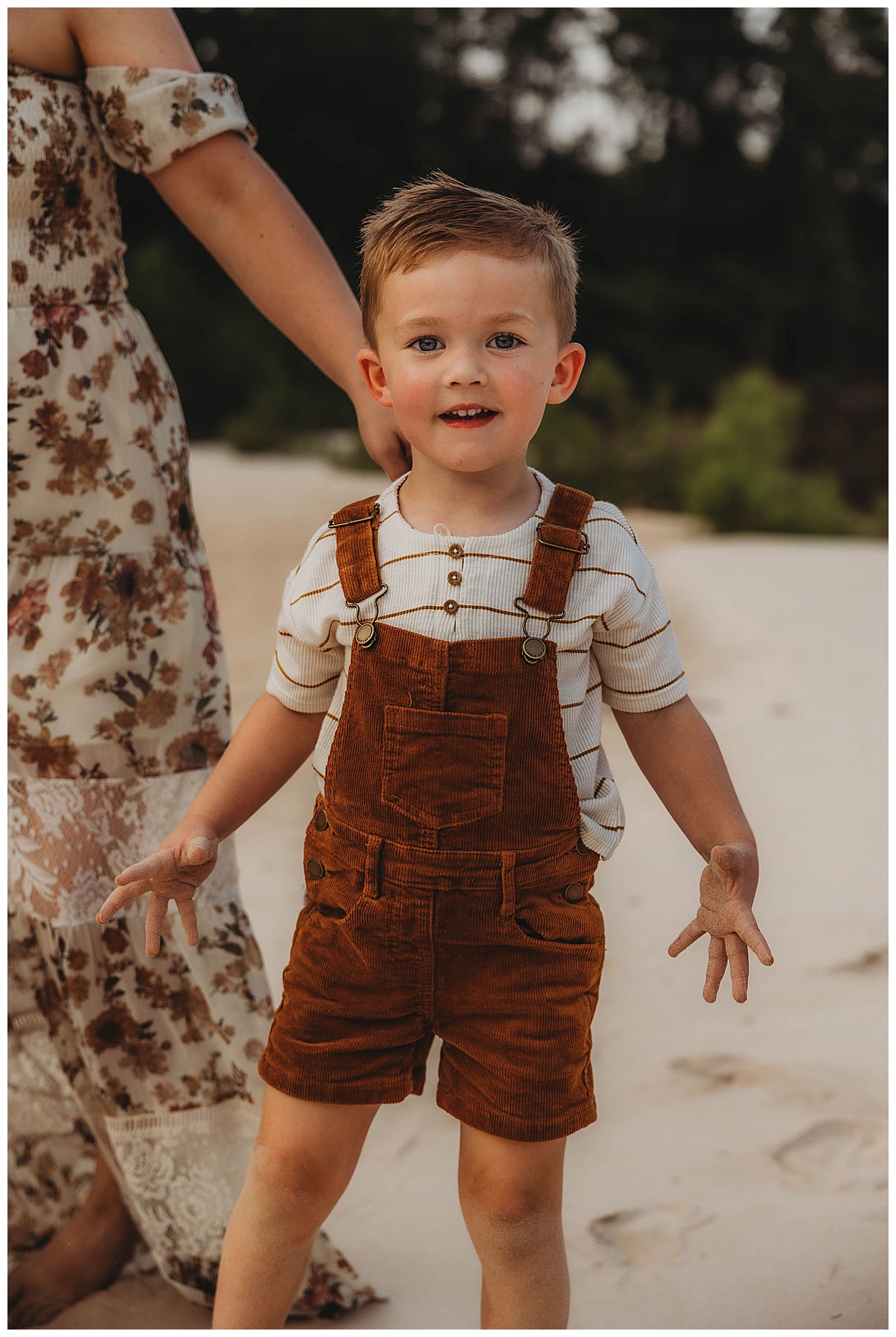 Young boy smiles big showing a reason Why you should choose Lifestyle Photography for Your Family