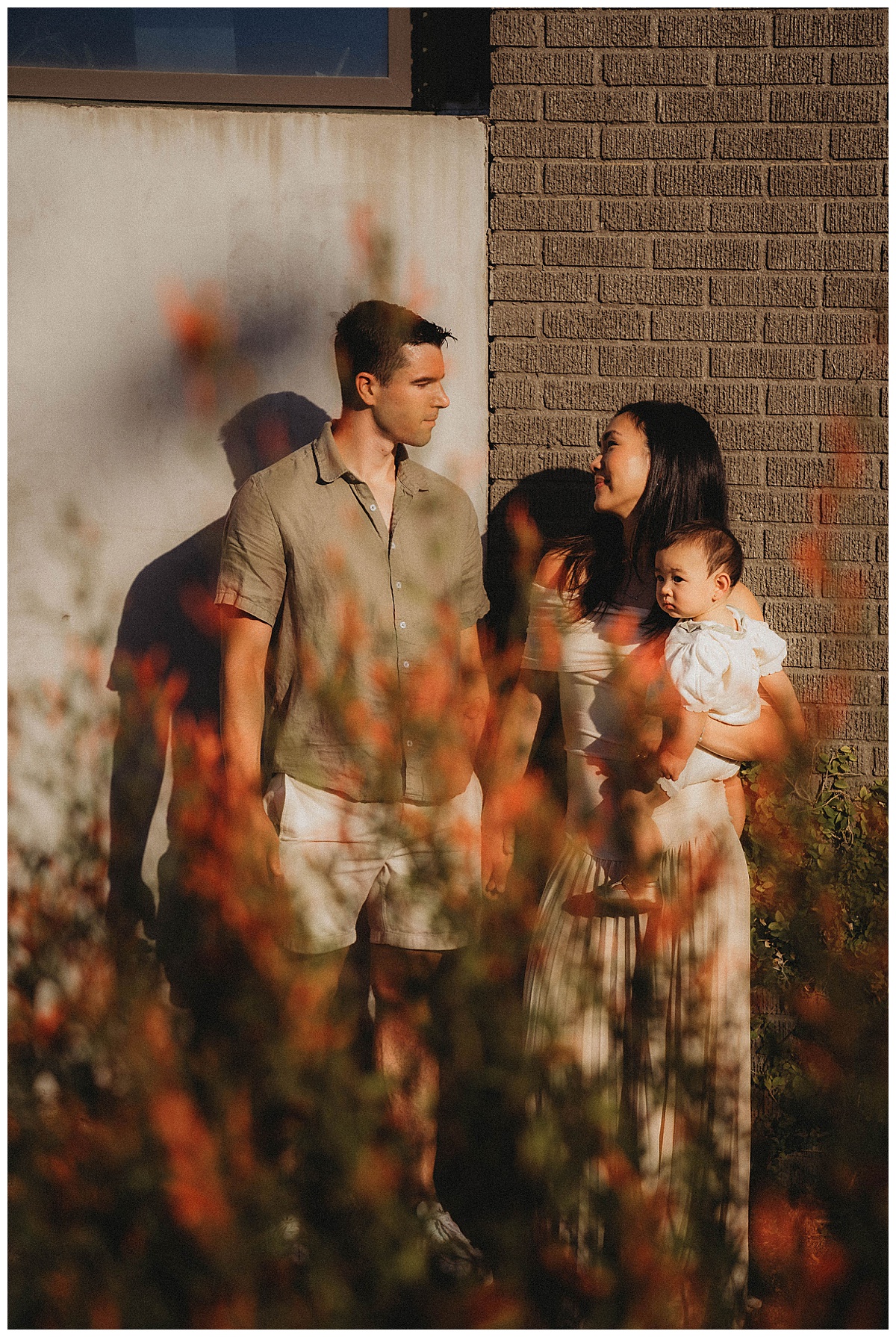 Mom and dad smile at one another for Maria Grace Photos