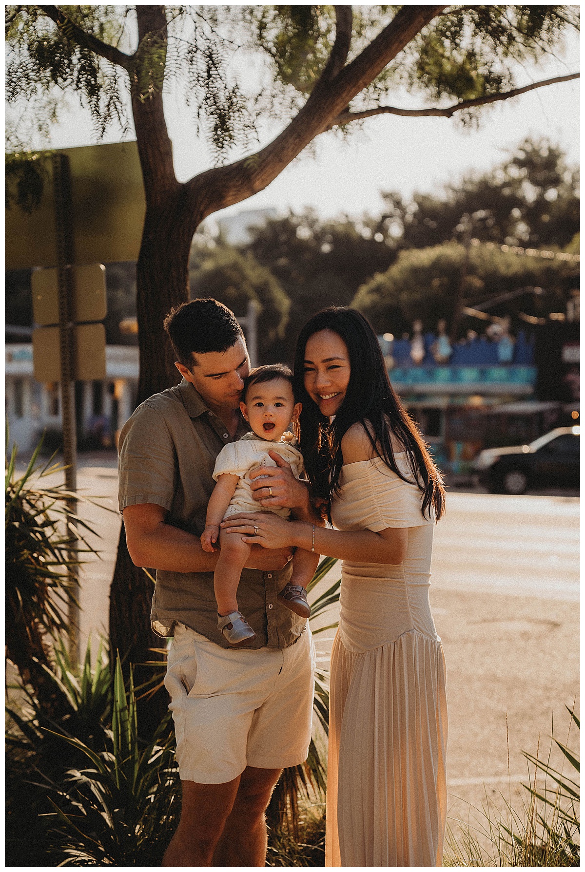 Parents cuddle their baby for The Woodlands Family Photographer