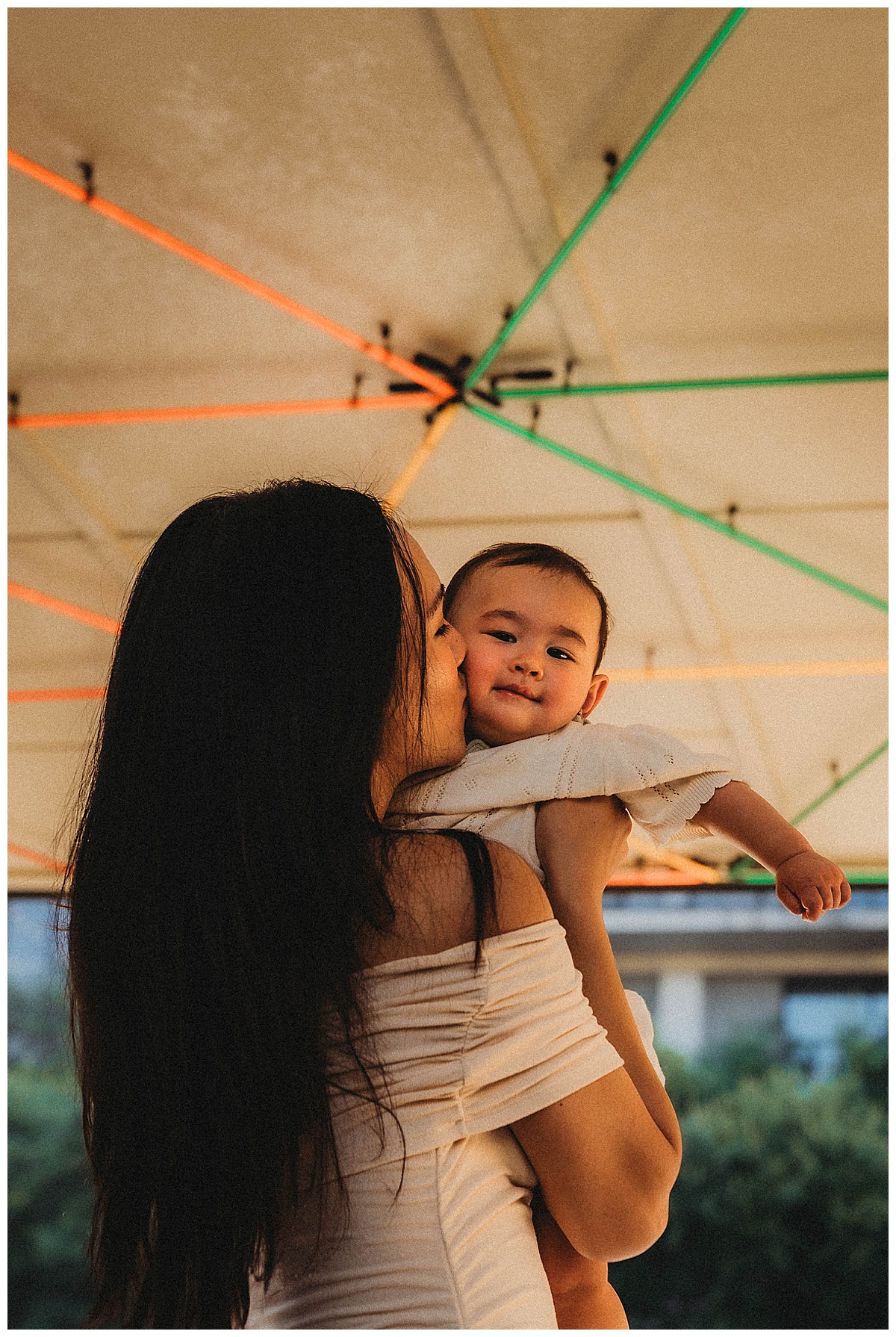 Mom holds baby close at one of my favorite Urban Locations