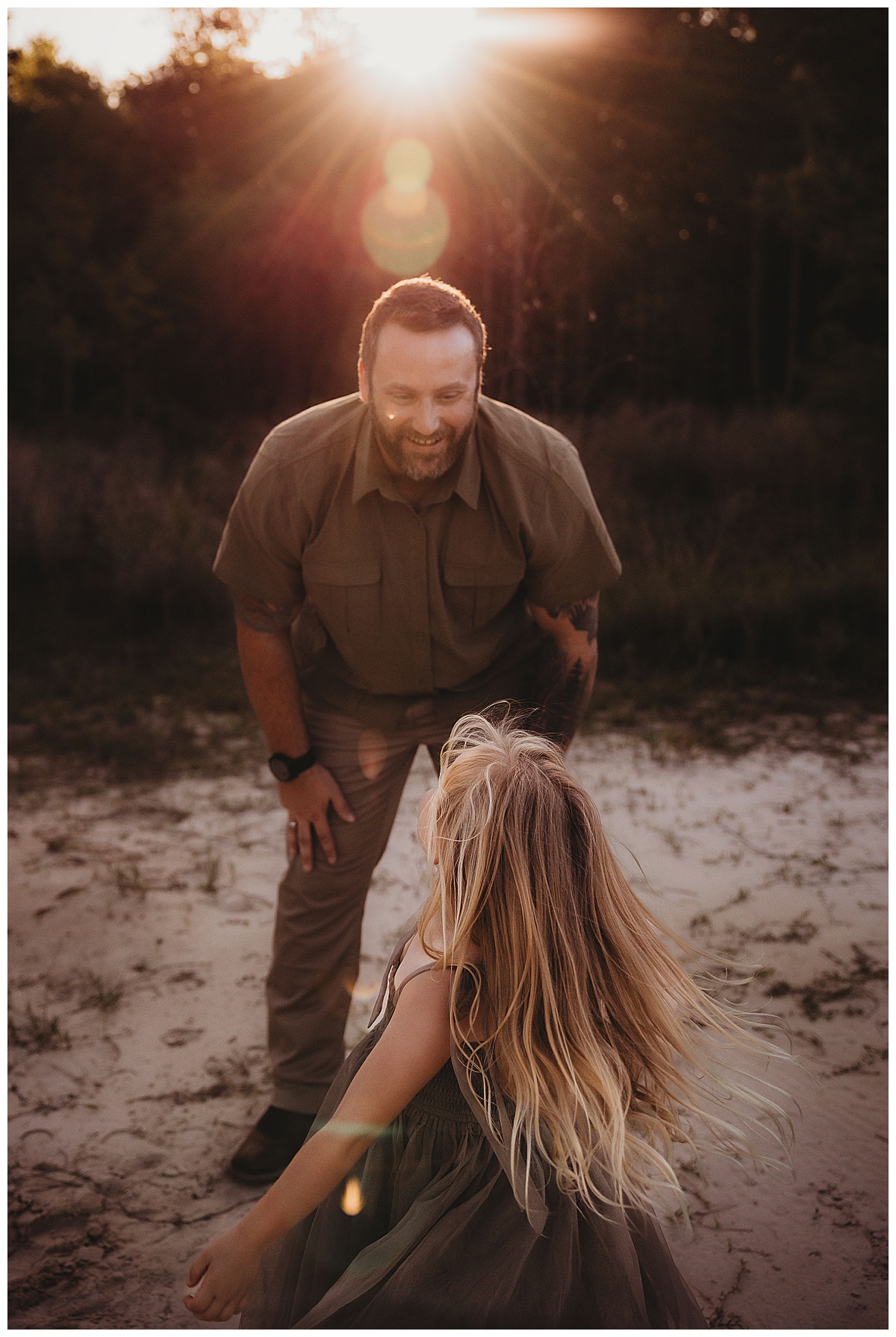 Dad and daughter play together for The Woodlands Family Photographer