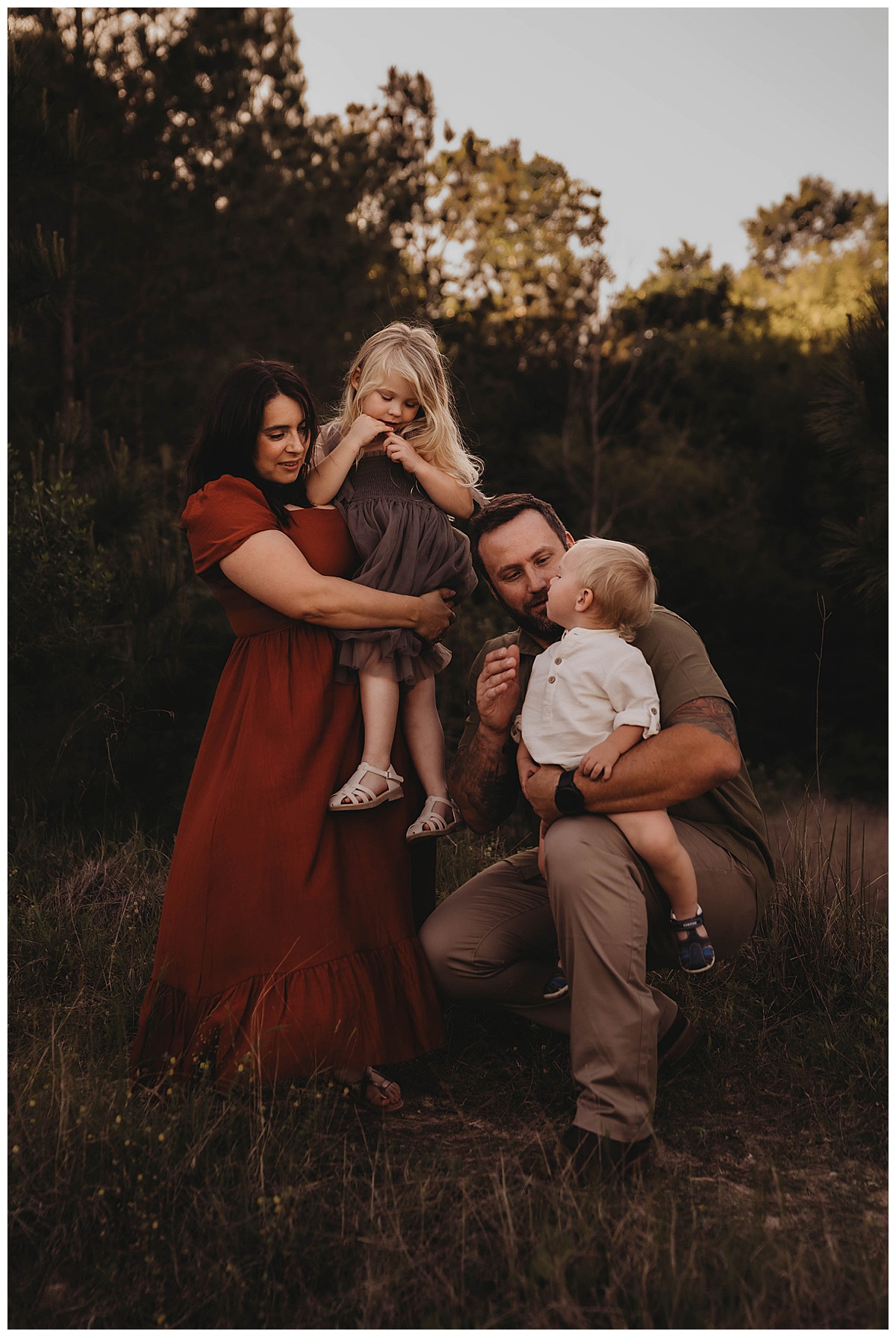 Family hold each other close forThe Woodlands Family Photographer