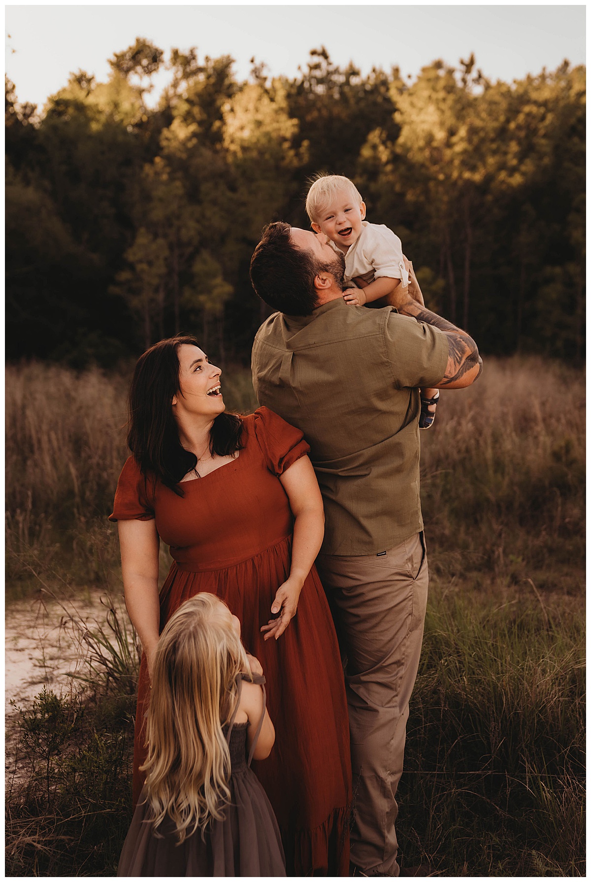 Parents hold their kids close together following my suggestion of Golden Hour for Family Photos