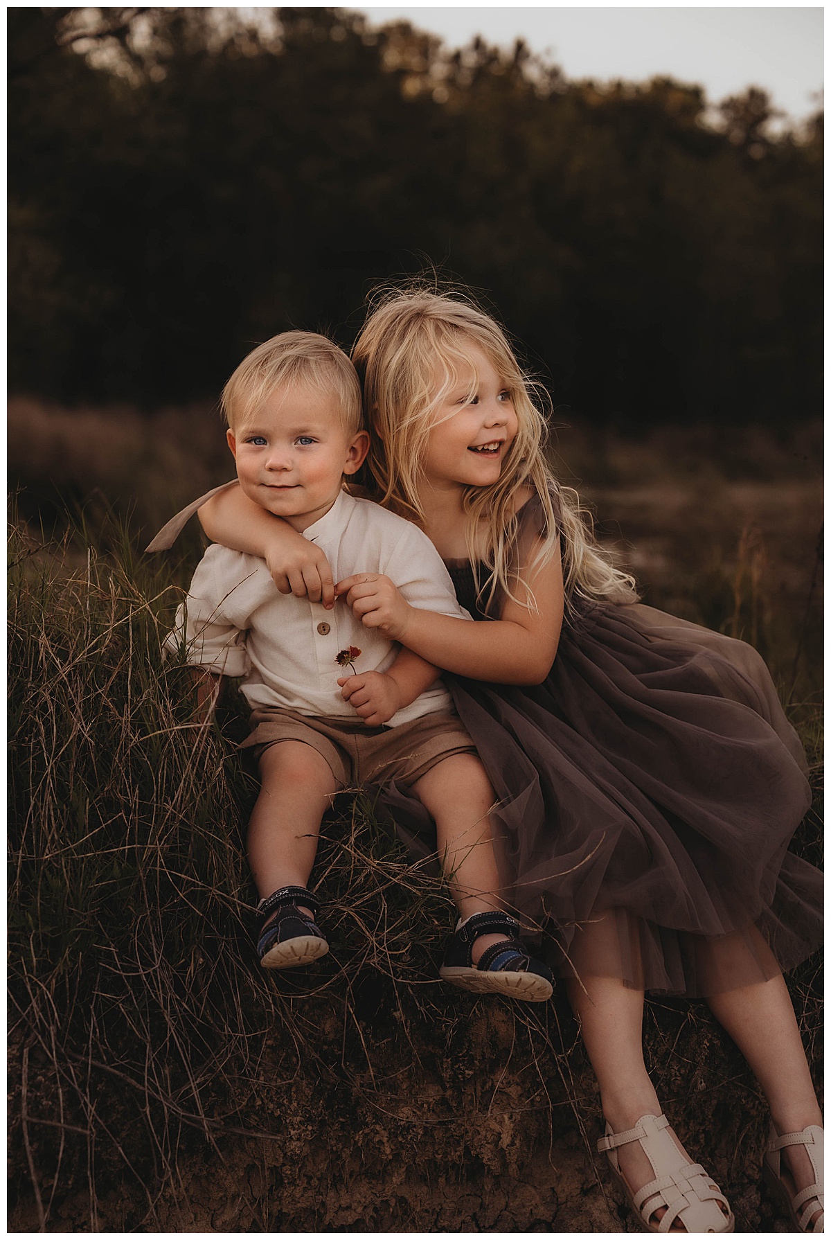 Young girl holds her brother close for Maria Grace Photos