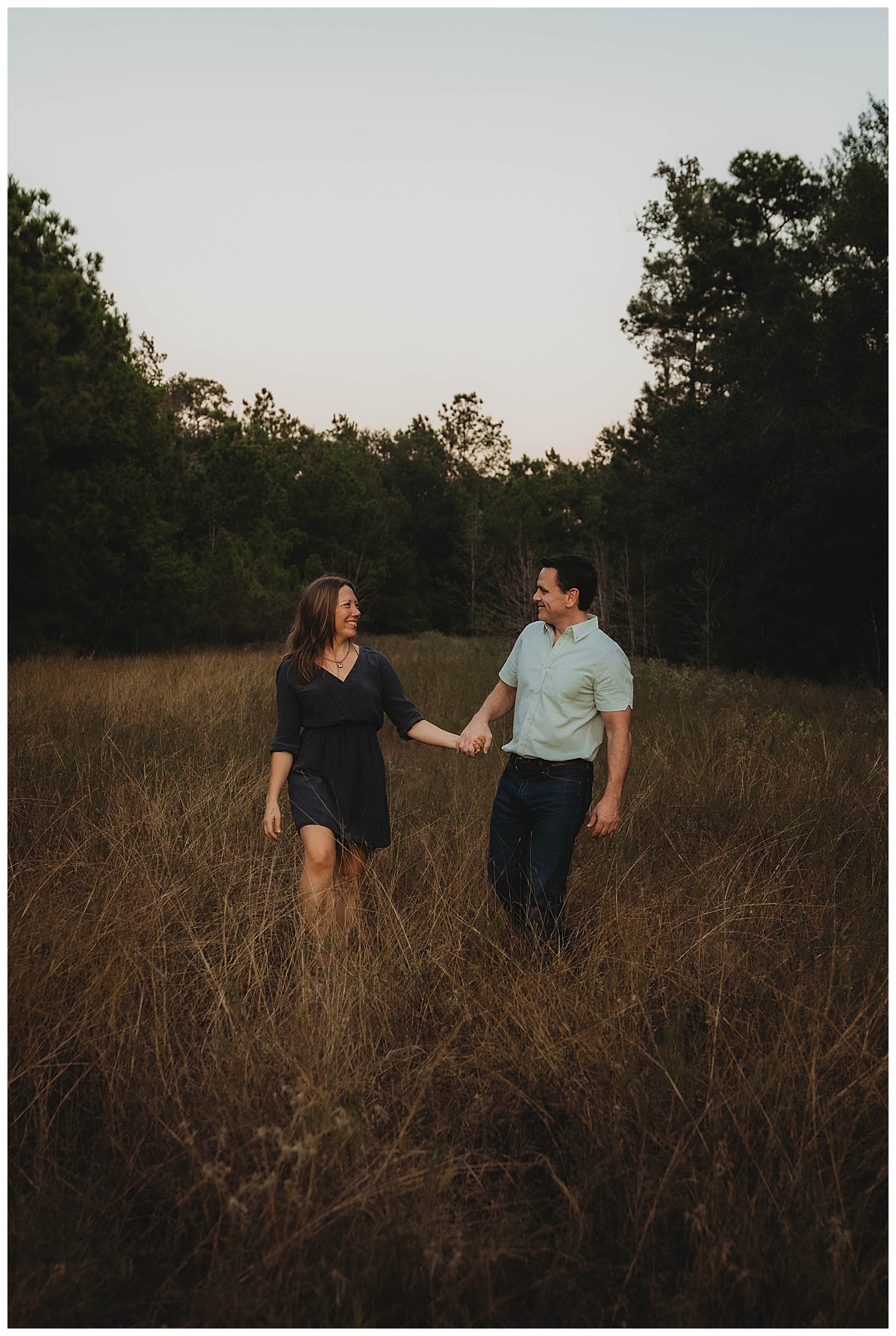 Parents walk hand in hand together for The Woodlands Family Photographer