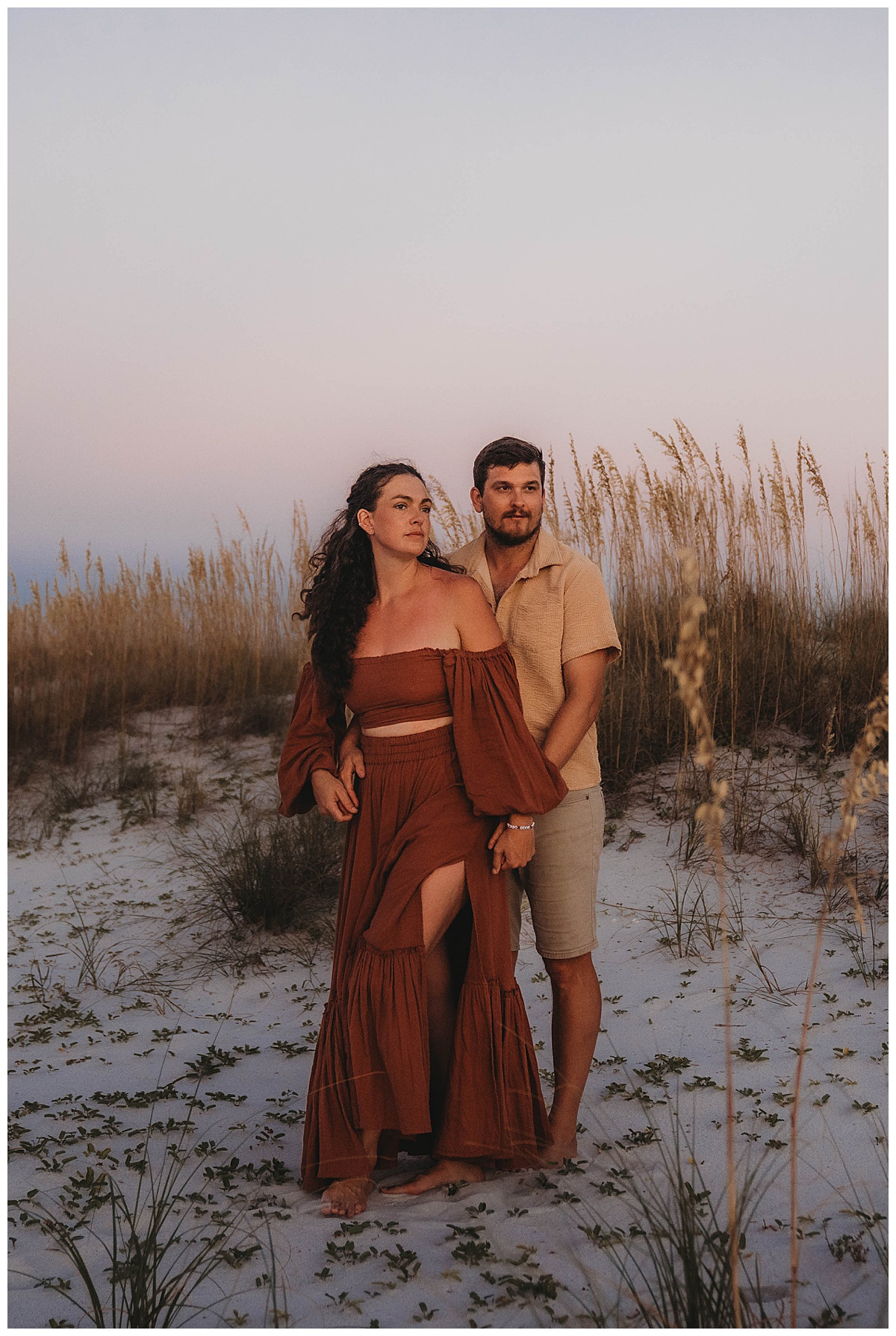 Couple holds each other close wearing a dress from my client closet