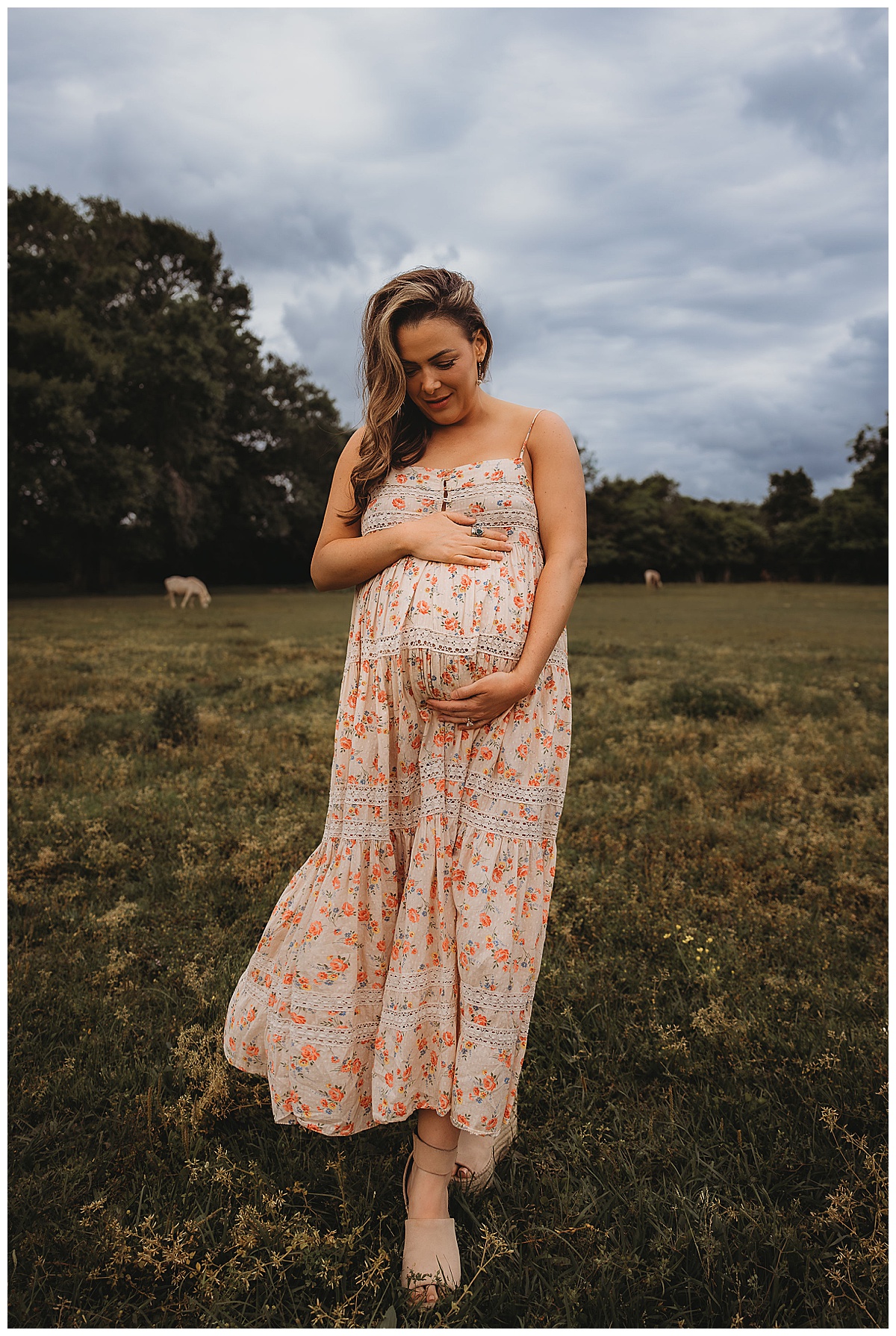 Mom embraces pregnant belly for The Woodlands Family Photographer