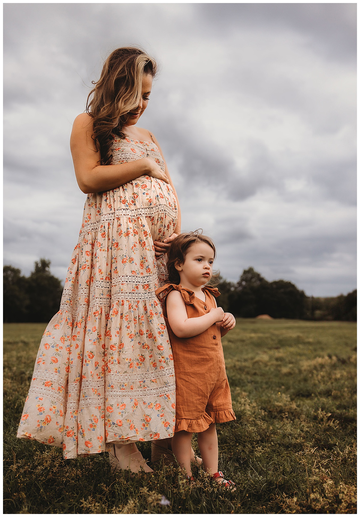 Mother and daughter stand together Embracing Imperfection during family photos 