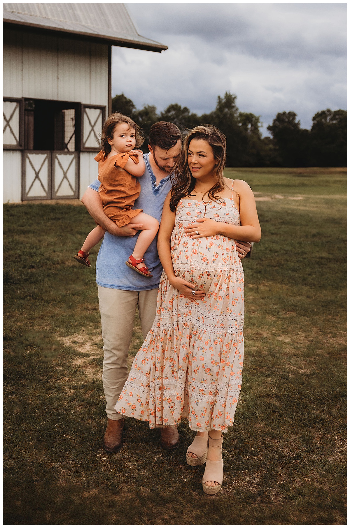 Mom holds pregnant belly with family close Embracing Imperfection during family photos 