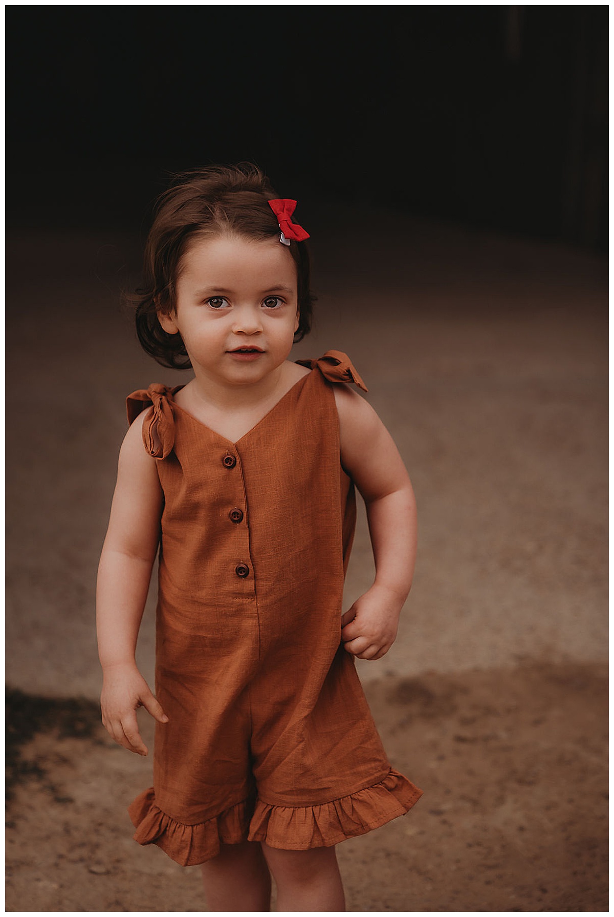 Little girl stands tall for The Woodlands Family Photographer