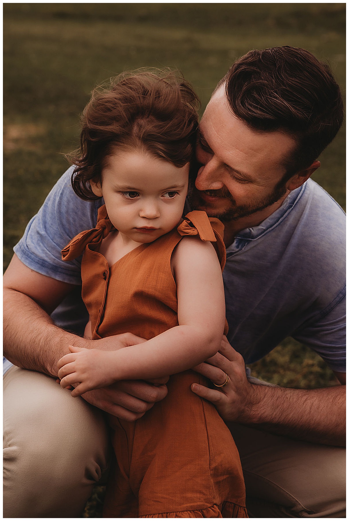 Dad embraces young girl for Maria Grace Photos