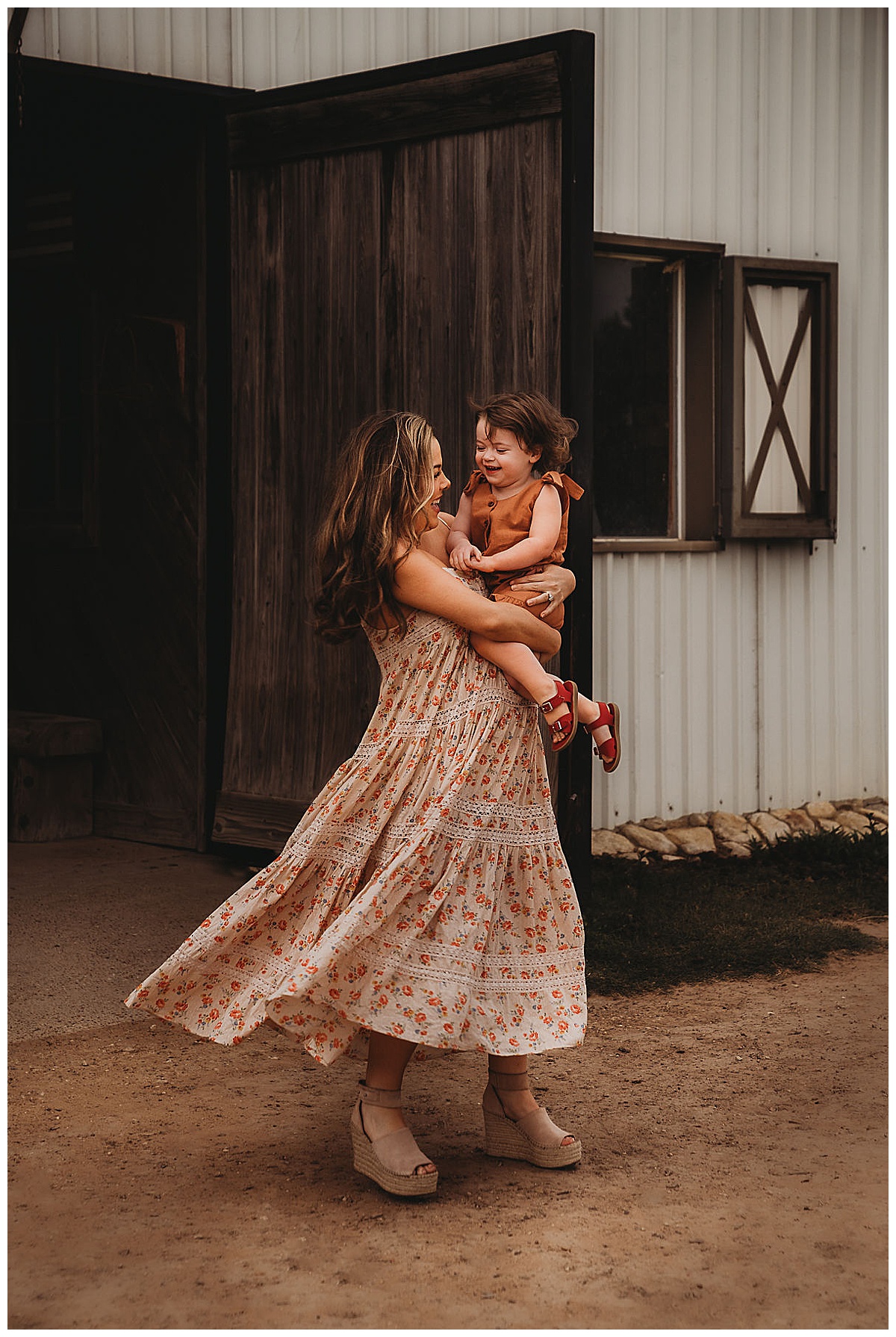 Mom holds young daughter for The Woodlands Family Photographer