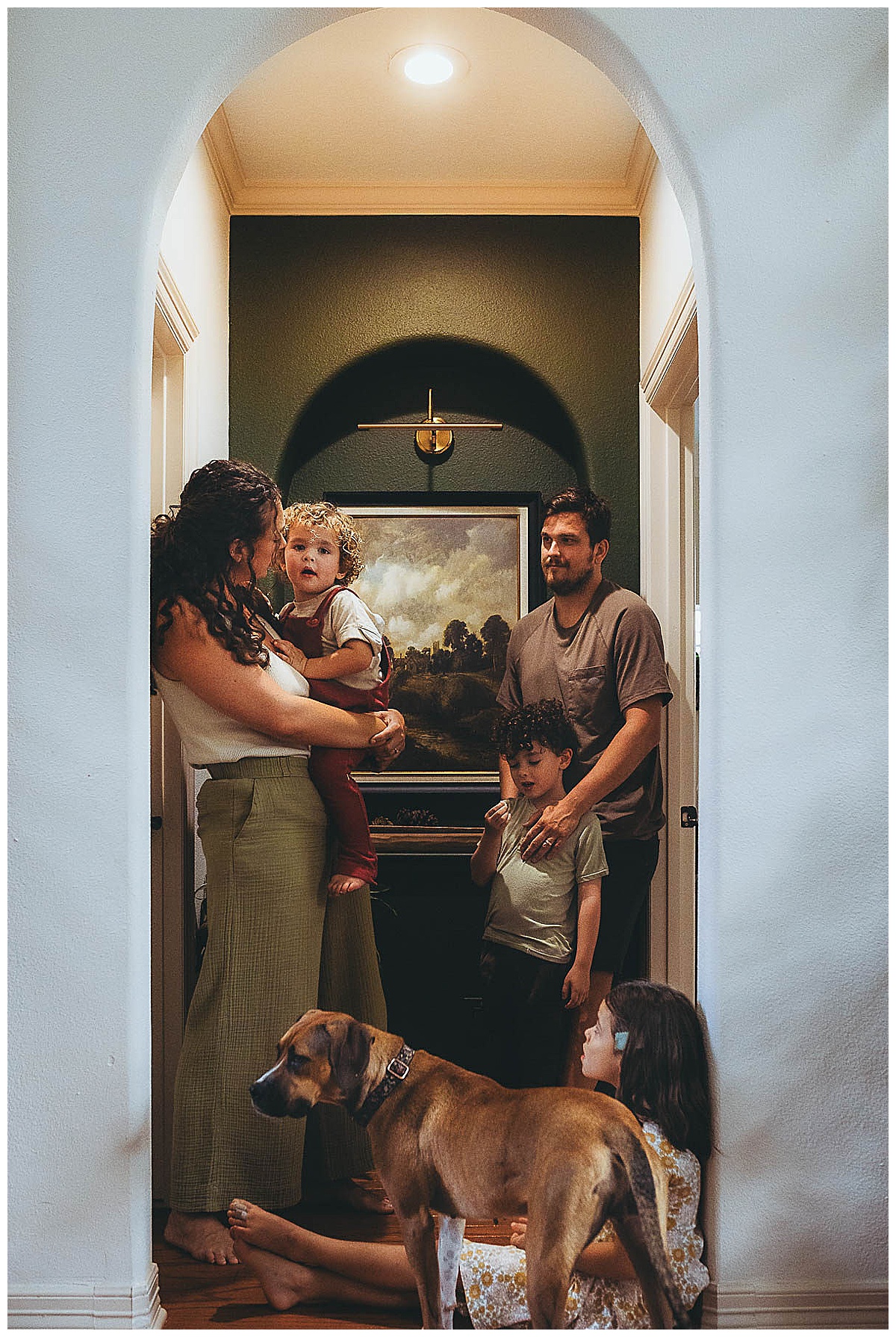 Family stand together in beautiful home by Maria Grace Photos